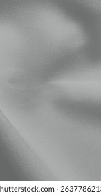 Silky, smooth background with a soft, light blue color. The background has a flowing texture, emphasizing the light blue hue. Gray textured mobile phone wallpaper with copy space.