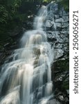 A silky waterfall running down on a rocky surface