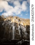 Silky waterfalls at Plitvice lakes national park, lit by the gentle, winter sun