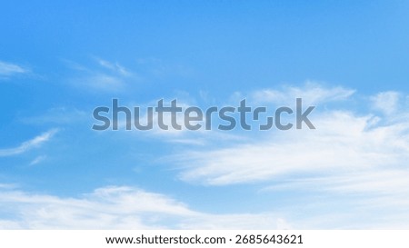 Silky white clouds blown by the wind in blue sky, sky view at summer.Beautiful sky background photo.