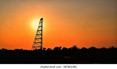  Sillhouette.Derrick Tower  In The Open Space. Preparation For Construction Industry And Business.