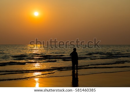 sillouette lovers and beach before sunset background