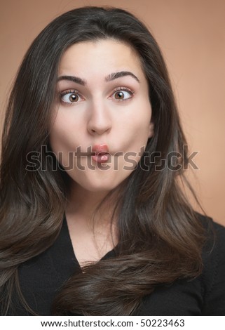 Silly funny face expression beautiful young woman