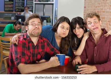 Silly group of people making faces in a bistro - Powered by Shutterstock