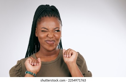 Silly, happy and black woman face with sassy emoji attitude facial expression in studio. White background, isolated and young model with fashion fashion with comic, crazy and goofy gesture alone