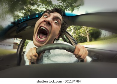 Silly man gets into car crash and makes ridiculous face - Shutterstock ID 301174784