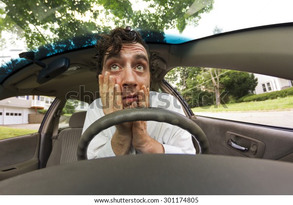 Silly\
man gets into car crash and makes ridiculous\
face