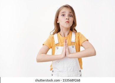 Silly Pretty Little Girl, Child Begging Buy New Toy, Hold Hands Pray, Supplicating, Pouting Lips With Tender Cute Gaze, Acting Lovely And Childish, Promise Do Homework After Favor, White Background