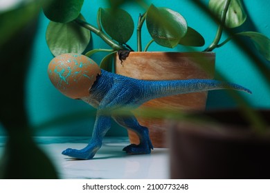 Silly Stubborn Dinosaur Hatching From Egg With Head Stuck