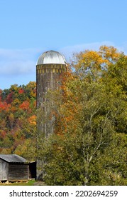 Silo And Barn Sit On Farm In The Appalachian Mountains.  Autumn Has Colored The Trees.