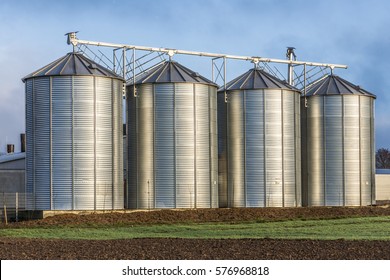 Silo in beautiful landscape with dramatical light placed in plouged acres