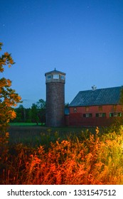 silo next to a barn