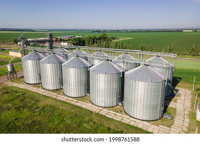 Silos on agro manufacturing plant for processing drying cleaning and storage of agricultural products, flour, cereals and grain. The granary silo of the elevator