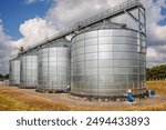 silos on agro-industrial complex with seed cleaning and drying line for grain storage. Granary elevator