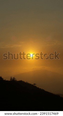 Siloute background with orange sunset