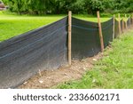 Silt Fence fabric with wooden posts installed prior to the start of construction.
