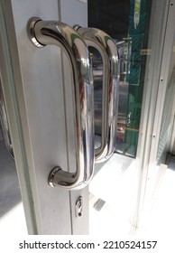 Silver Aluminum Door Handle For Storefront Glass Door.  Tarakan, Indonesia, October 6, 2022