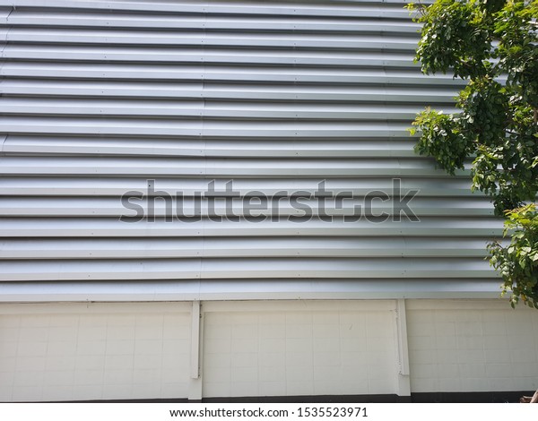 Silver aluminum louver on the wall for ventilation and lighting with