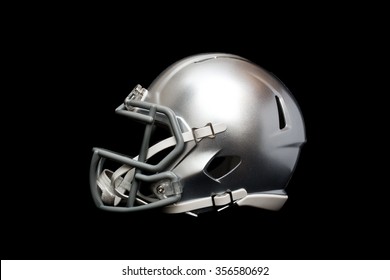 Silver american football helmet isolated on black background