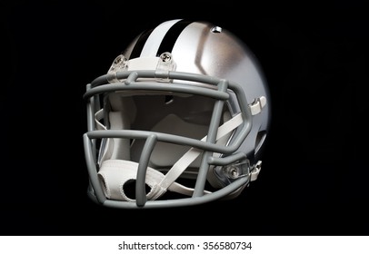 Silver American Football Helmet Isolated On Black Background