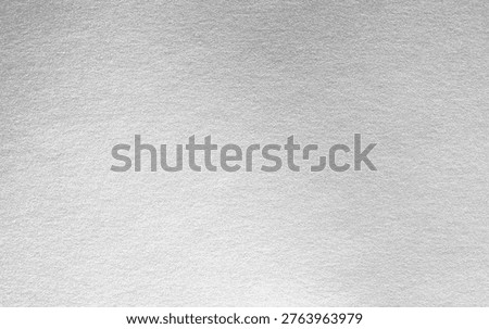 Silver background foil leaf metallic texture wrapping paper shiny glowing white grey solid reflective gradient color metal pattern backdrop for wallpaper decoration element backdrop