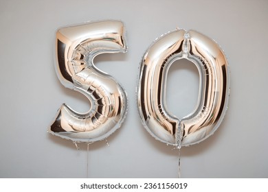 silver balloons number 50 and a bunch of latex balloons with helium