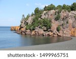 Silver Bay Black Beach, North Shore Lake Superior. Crescent black taconite sandbar on Lake Superior.