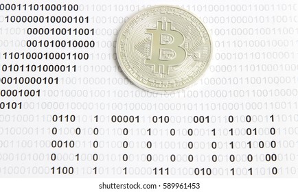 silver bitcoin on the background of binary code