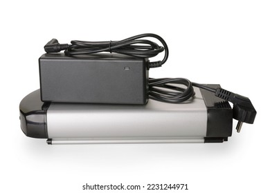 Silver and black li-ion battery for e-bike and charger set. Isolated on white, clipping path included - Shutterstock ID 2231244971