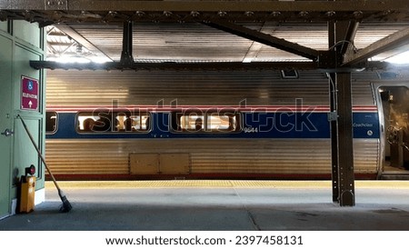 Silver and blue train at train station