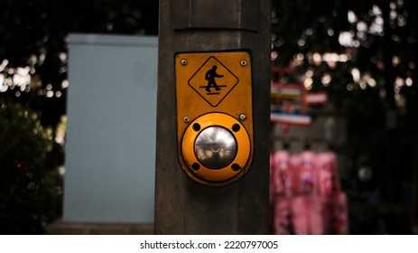 Silver Button And Symbol For Pedestrians On Highway Traffic Light Pole