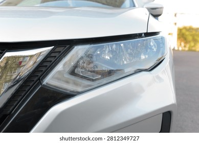 Silver Car Headlight Assembly Close-Up