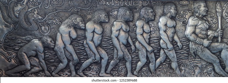 Silver Carving. Thai Style Silver Carving Art At Temple Wall , Wat Srisuphan ,Chiang Mai, Thailand. Human Evolution Concept.