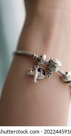 silver Charm bracelet close up  with cute boy travel charm - Shutterstock ID 2022445910