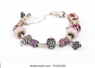 Silver Charm Bracelet With Pink Beads Isolated On White Background