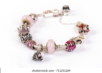 Silver Charm Bracelet With Pink Beads Isolated On White Background