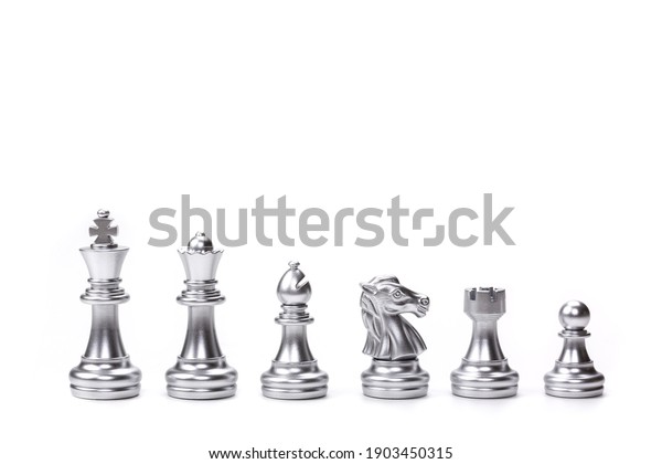 Silver chess pieces six\
different types used on chessboard to play the game of chess. left\
to right: king, queen, bishop, knight, rook, pawn isolated on white\
background