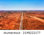 Silver city highway from Adelaide to Broken hill at entrance to Broken Hill city in australian red soil outback.