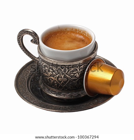 Silver coffee cup with capsule isolated on white
