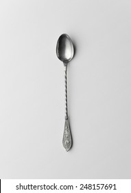 Silver Coffee Spoon Over White Background, Top View