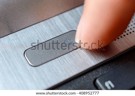 silver color power button macro closeup
