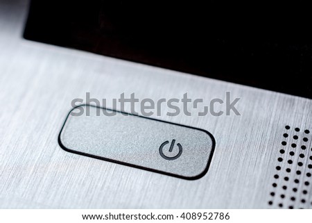 silver color power button macro closeup