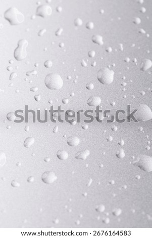 silver colored metal surface covered with drops of pure water, wet silver-colored metal painted to protect aluminum alloy and metals, close up