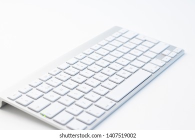 Silver computer keyboard in the white table