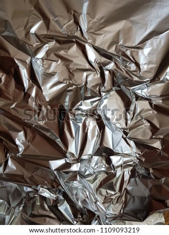 Silver crumpled aluminium foil texture