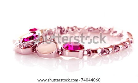 silver and diamonds bracelet with pink stones on white background