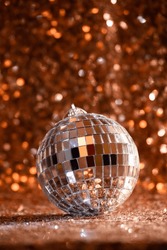 Silver and gold disco balls hang from the ceiling on New Years eve Holiday  Stock Photos