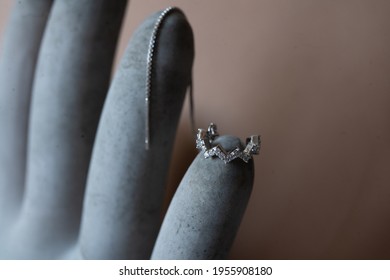 Silver Ear Cuff On Concrete Background