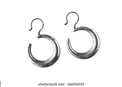 Silver Earrings In The Shape Of Crescent Isolated Over White