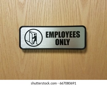 Silver Employees Only Sign On Door